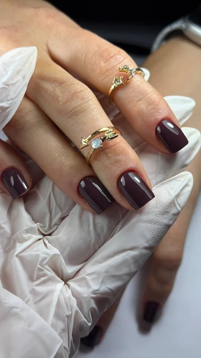 Burgundy polish with gold rings
